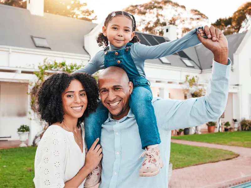 Family portrait in front of a house